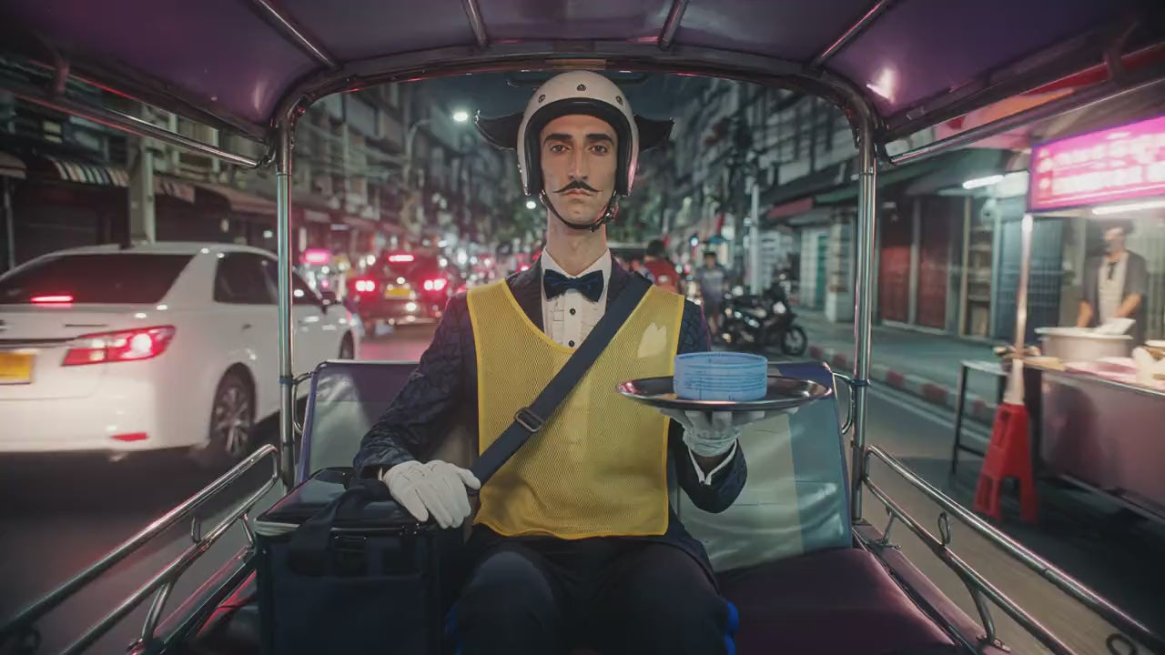The butler delivers butter by tuk-tuk through Bangkok at night